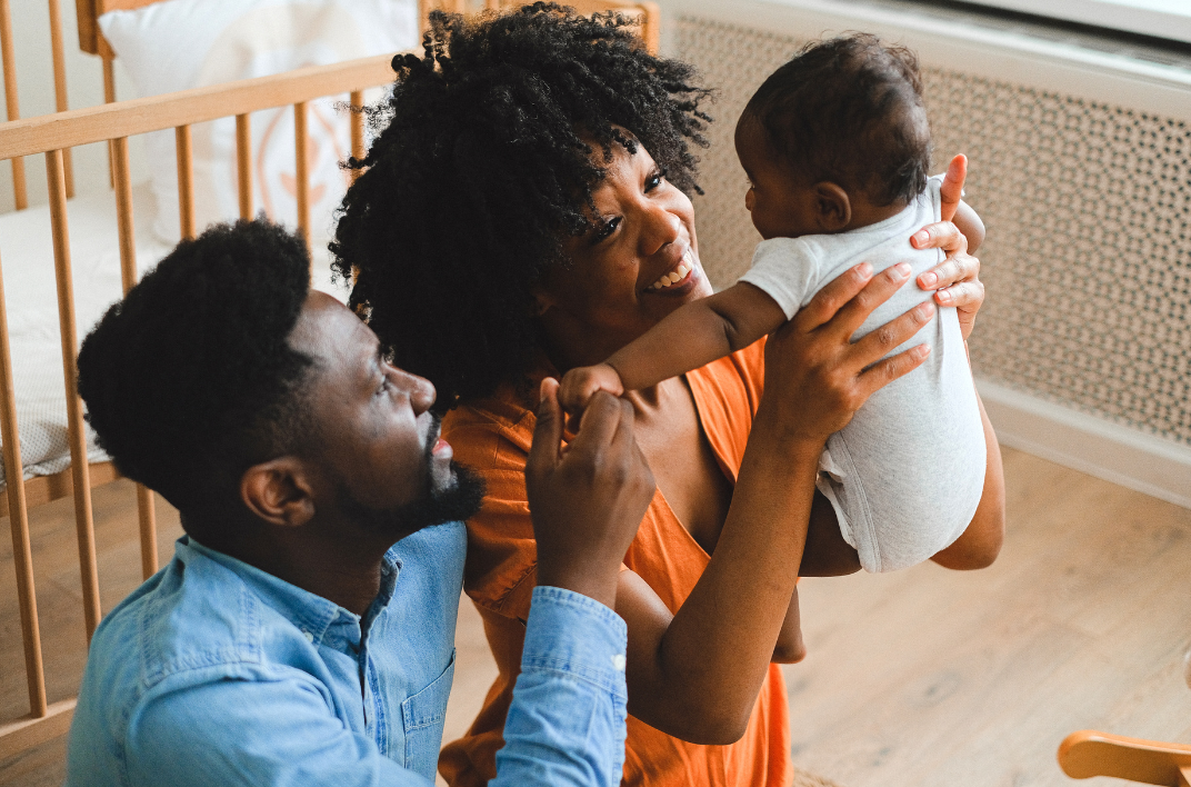 black couple with newborn baby