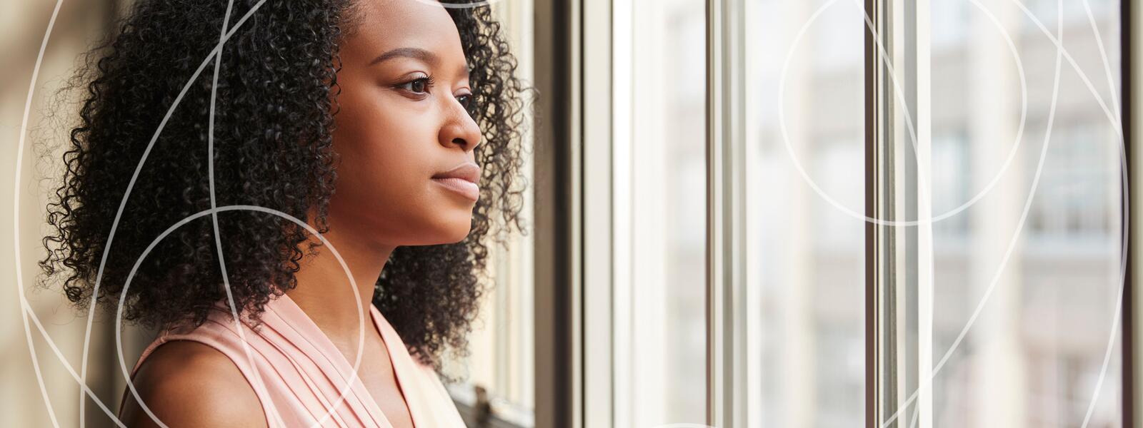 Woman looking out window