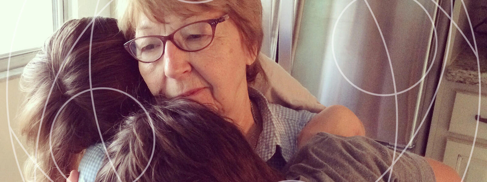 grandmother hugs two children