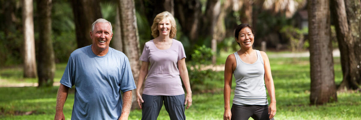 three people in a park