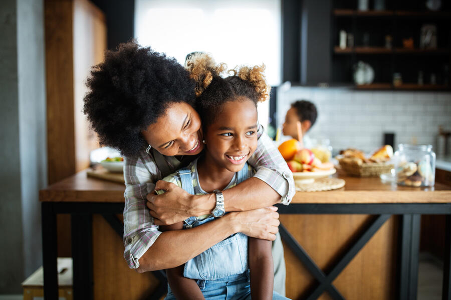 Mother and child smiling and hugging