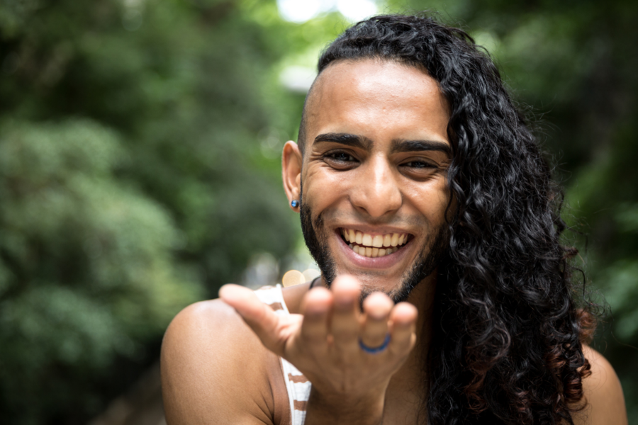 BIPOC person smiling at camera