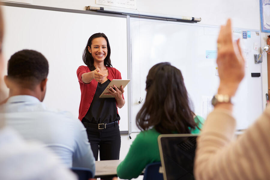 Teacher calling on student - continuing education