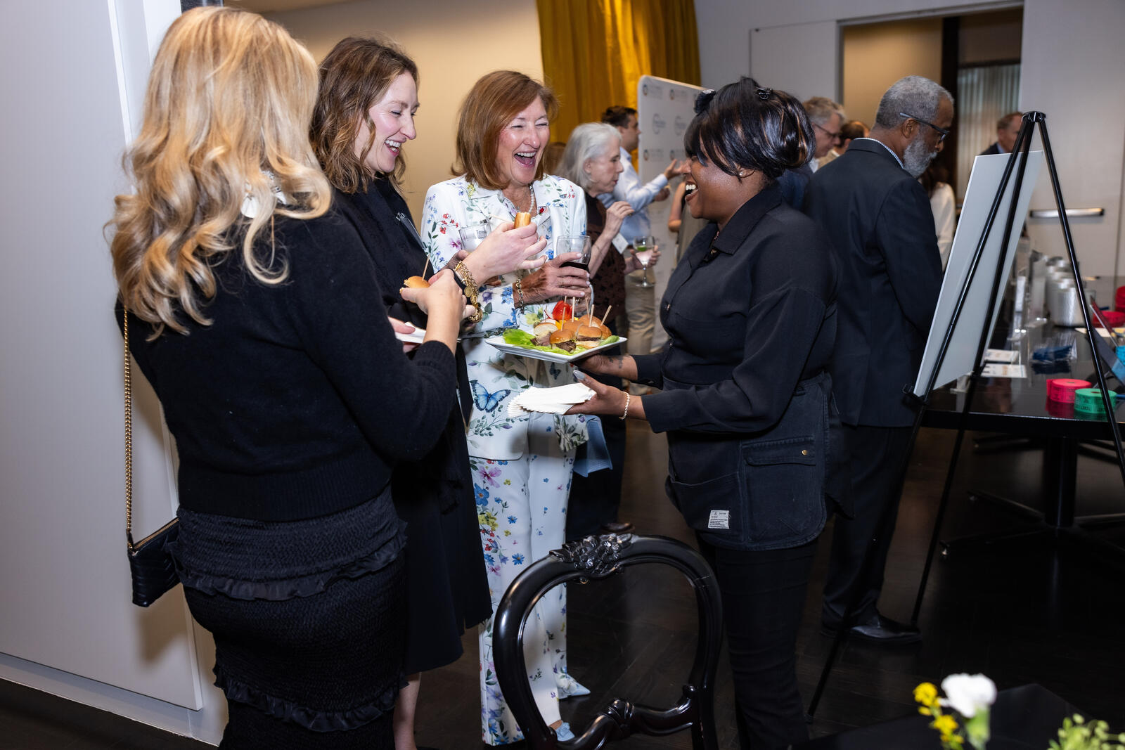 In Session Guest enjoys passed hors d'oeuvres.